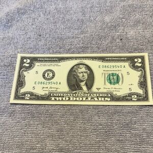 Uncirculated $2 Federal Reserve Note with lower than average serial number.